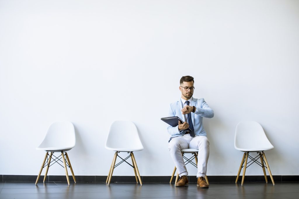 The candidate is waiting for his turn for an interview.