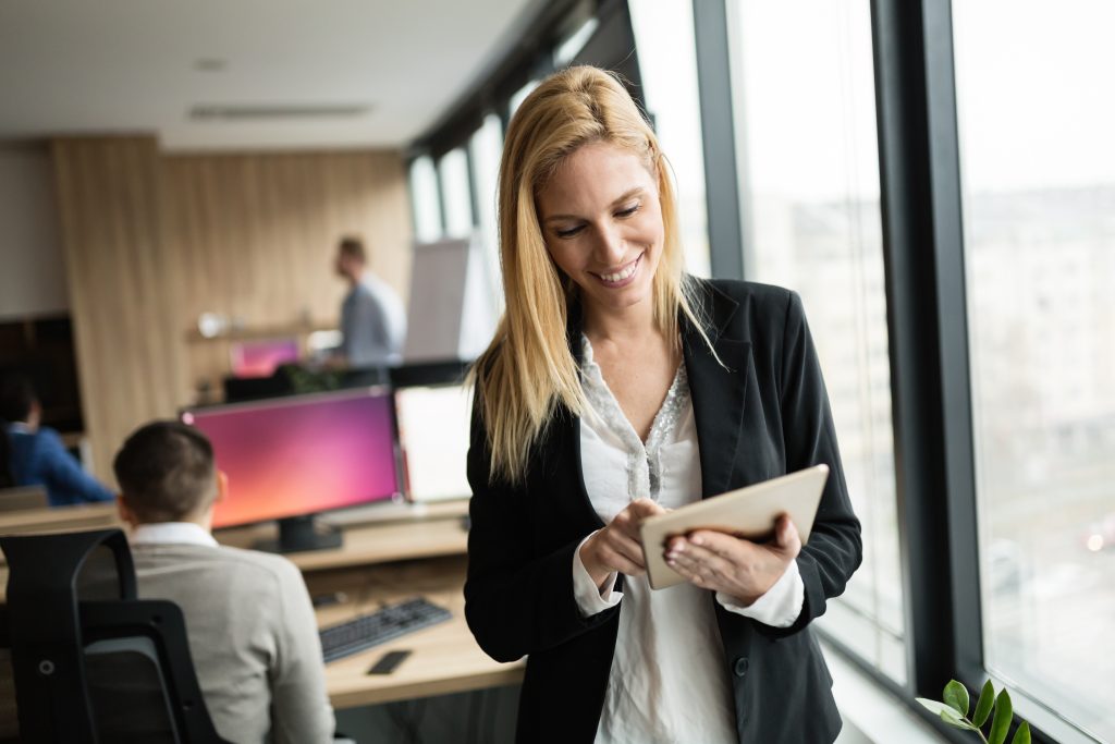 Recruiter examining HR technology trends and developments, analyzing data and tools for improved hiring practices.