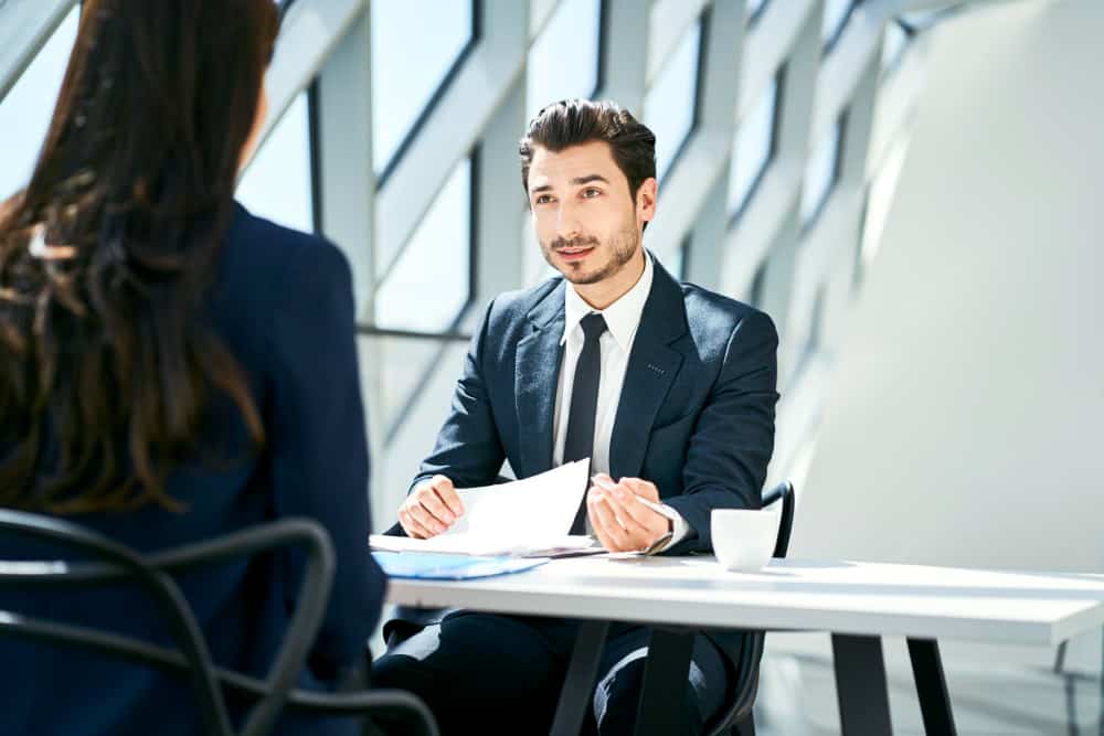 A recruiter using effective screening strategies to evaluate candidate