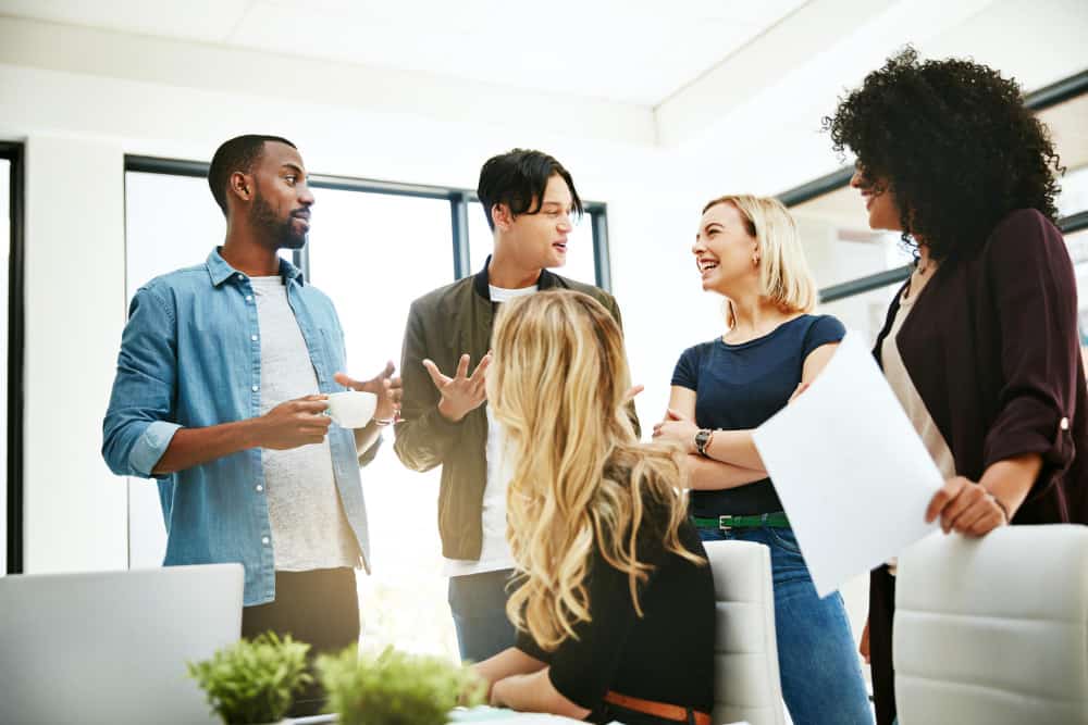 A diverse team of recruiters designing a DEI framework