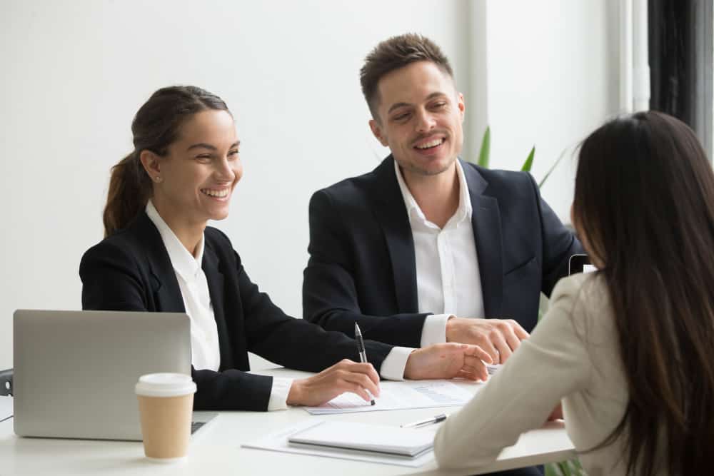 Recruiter Happily Interviewing Candidate for Job Opening
