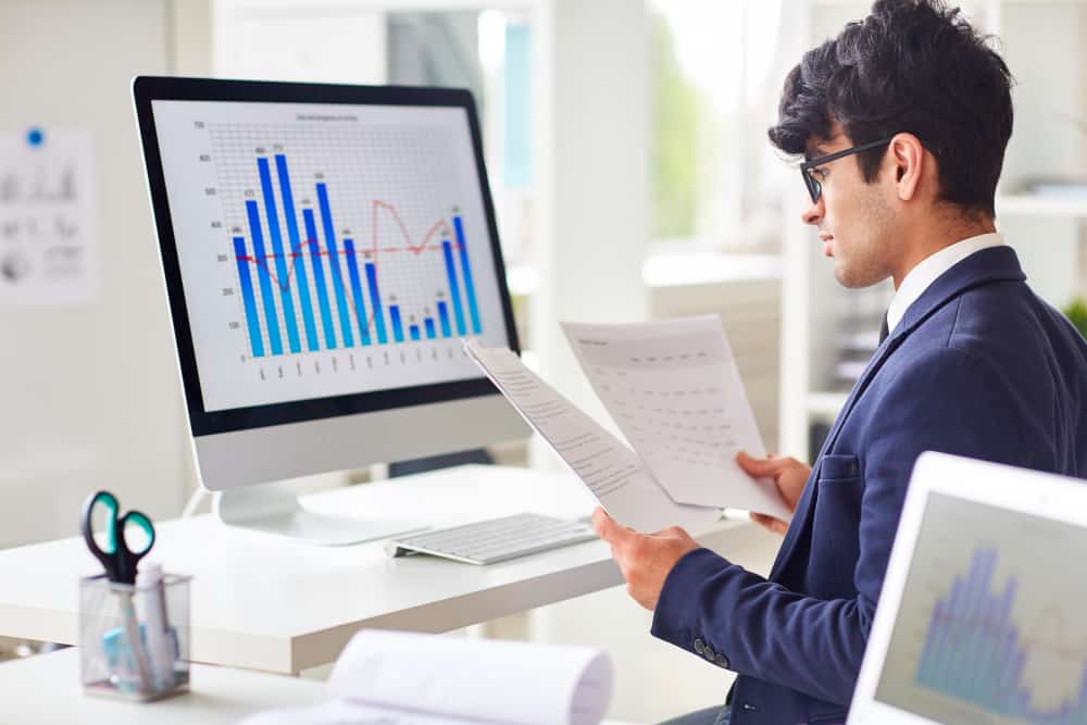 Recruiter Looking into Recruitment Process Improvement through Recruitment Analytics
