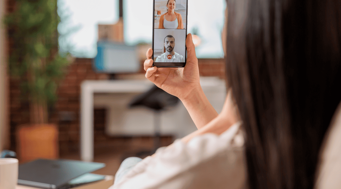 A Woman Chatting with Other People Online Via Her Phone