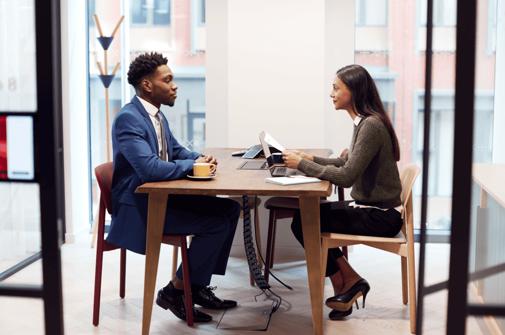 businesswoman-interviewing-a-job-candidate-in-a-meeting-room