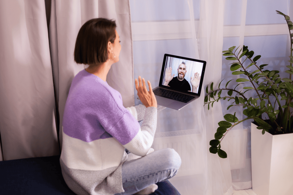 Candidate Waving to the Other Person During an Interview