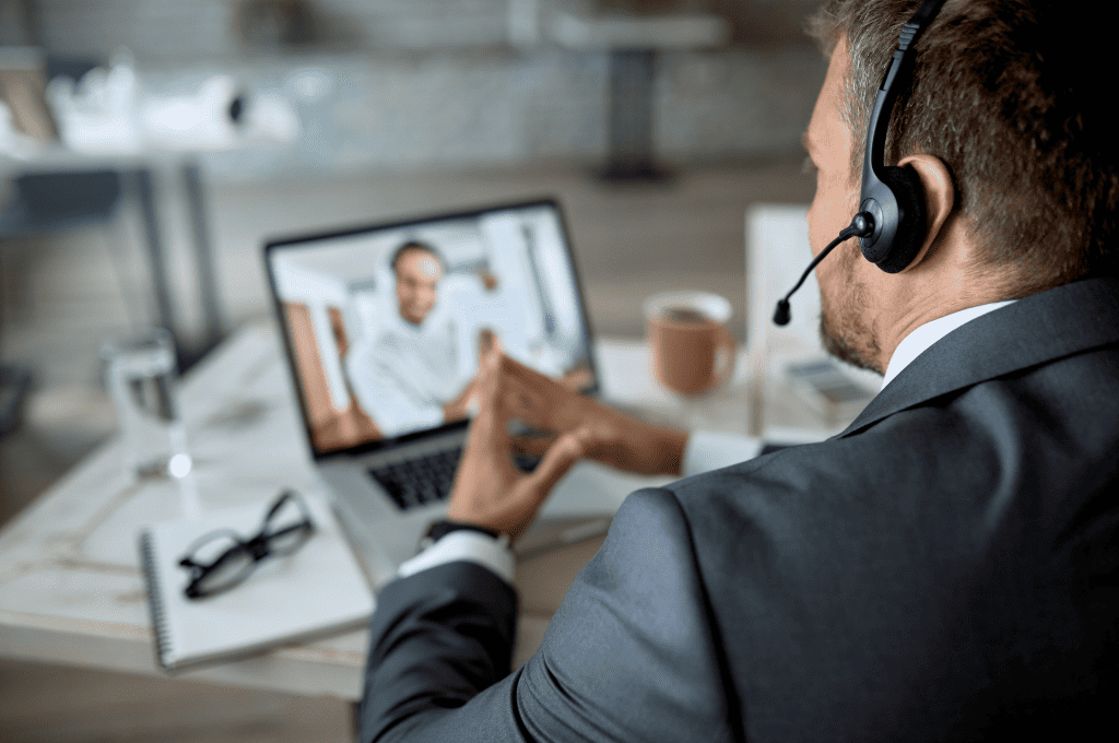 Entrepreneur Using Laptop While Conducting an Online Interview
