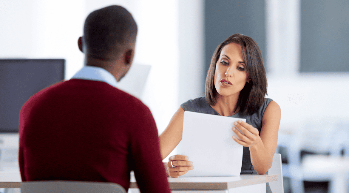 HR manager discussing the online resume with a candidate