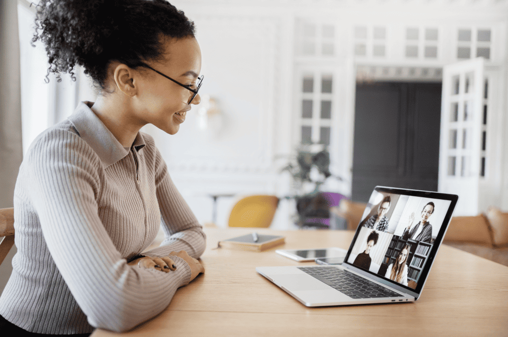 Woman in a video conference with four other people