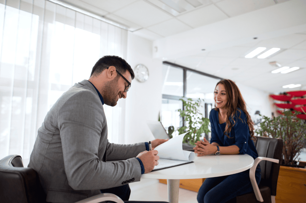 HR manager conducting candidate experience survey with new candidate