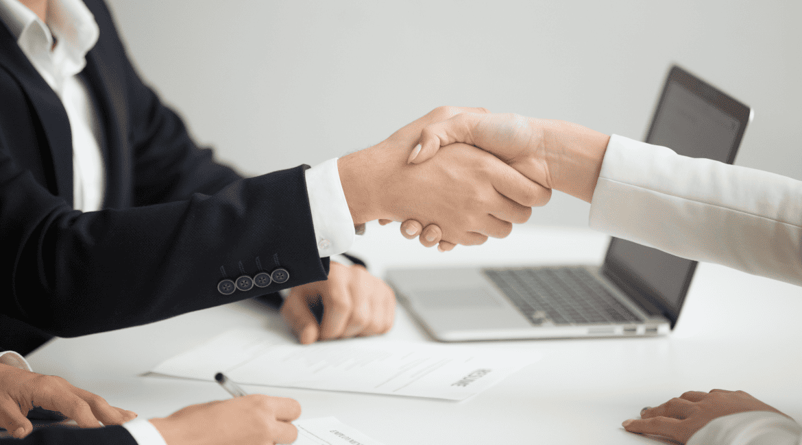 HR handshaking successful candidate getting hired new job closeup