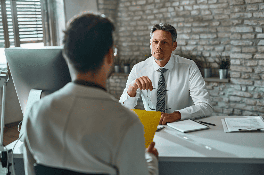 Member of HR team having job interview with candidate in office