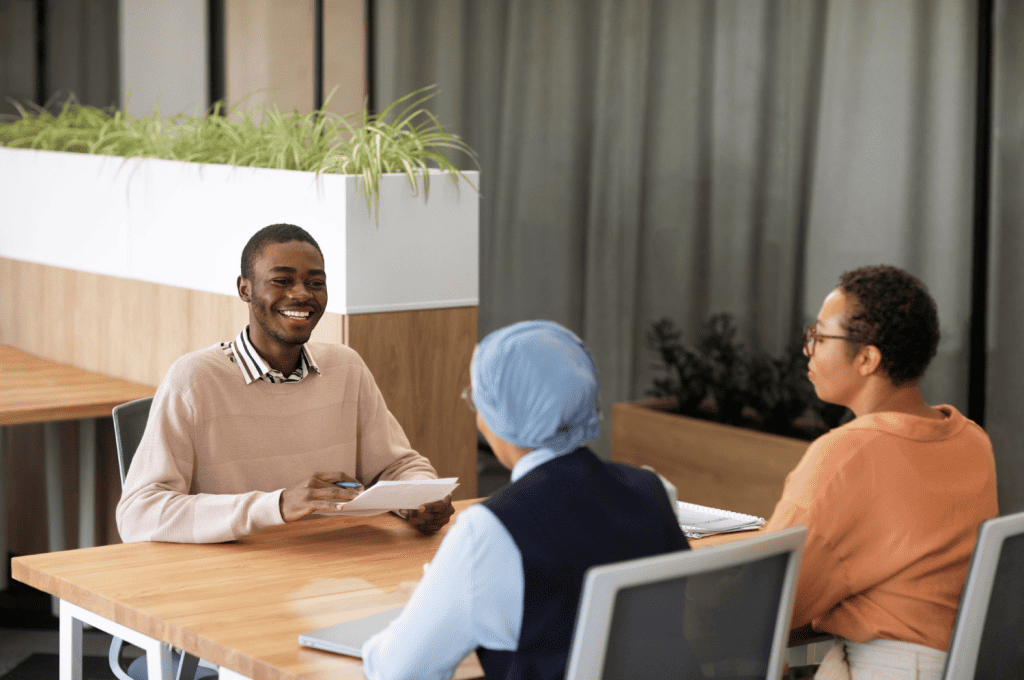 Recruiter Speaking With Candidate and Using Survey To Create Positive Recruitment Journey