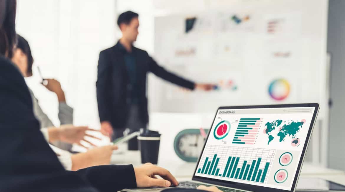 Recruiter analyzing data and tools for improved hiring practices.